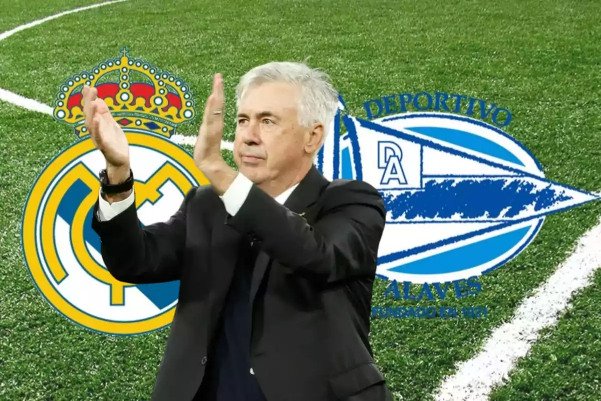 Un entrenador aplaudiendo con los escudos del Real Madrid y Deportivo Alavés de fondo en un campo de fútbol.