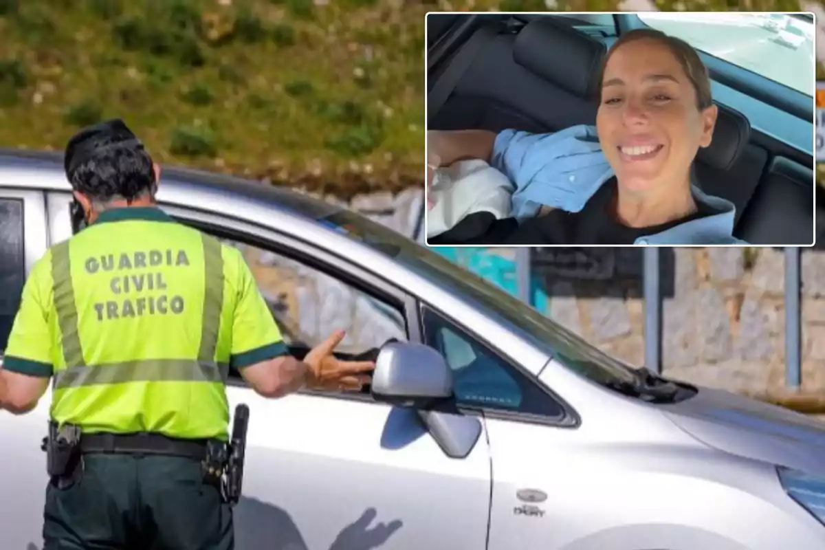 Un agente de la Guardia Civil de Tráfico detiene un coche en la carretera mientras una persona sonríe desde el interior del vehículo.