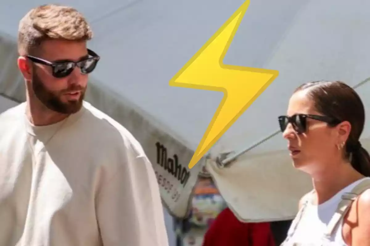 Dos personas con gafas de sol conversan al aire libre bajo una sombrilla, con un rayo amarillo dibujado entre ellos.