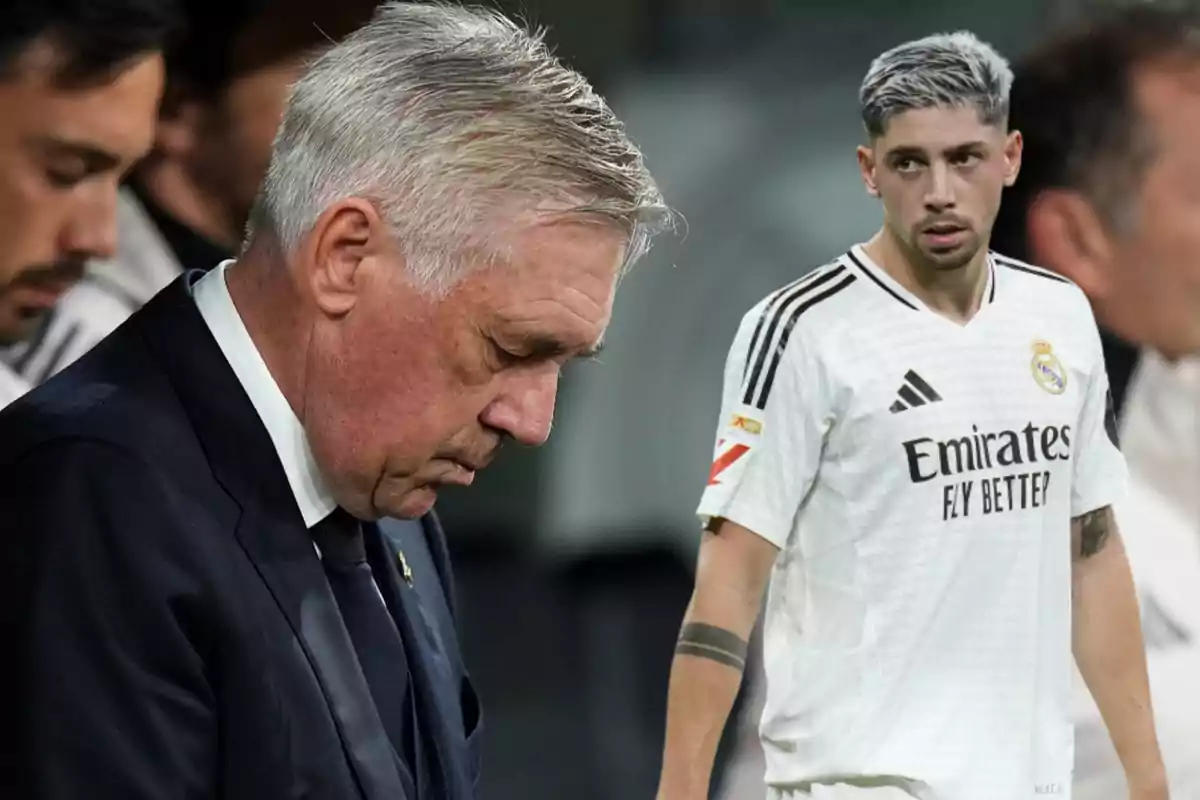 Un entrenador de fútbol con expresión seria y un jugador en uniforme blanco del Real Madrid en el campo.