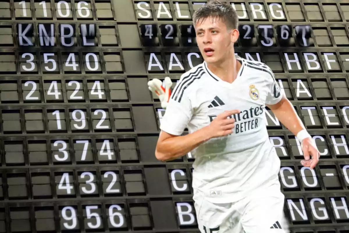 Un jugador de fútbol con el uniforme del Real Madrid aparece frente a un tablero de horarios de trenes.