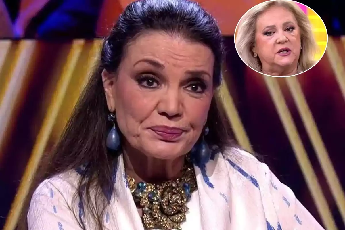 Una mujer con cabello oscuro y aretes grandes está en un programa de televisión, con una expresión seria; en la esquina superior derecha hay un recuadro con otra mujer de cabello claro.