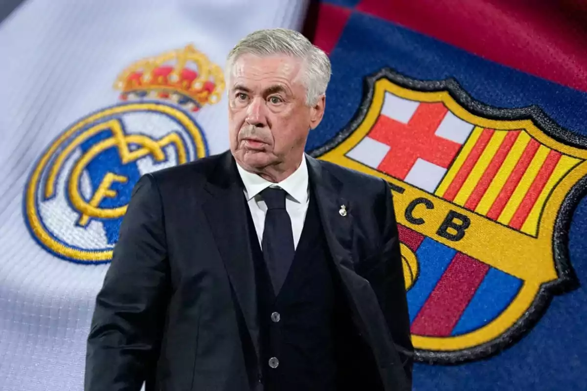 Un hombre de traje frente a los escudos de los equipos de fútbol Real Madrid y FC Barcelona.