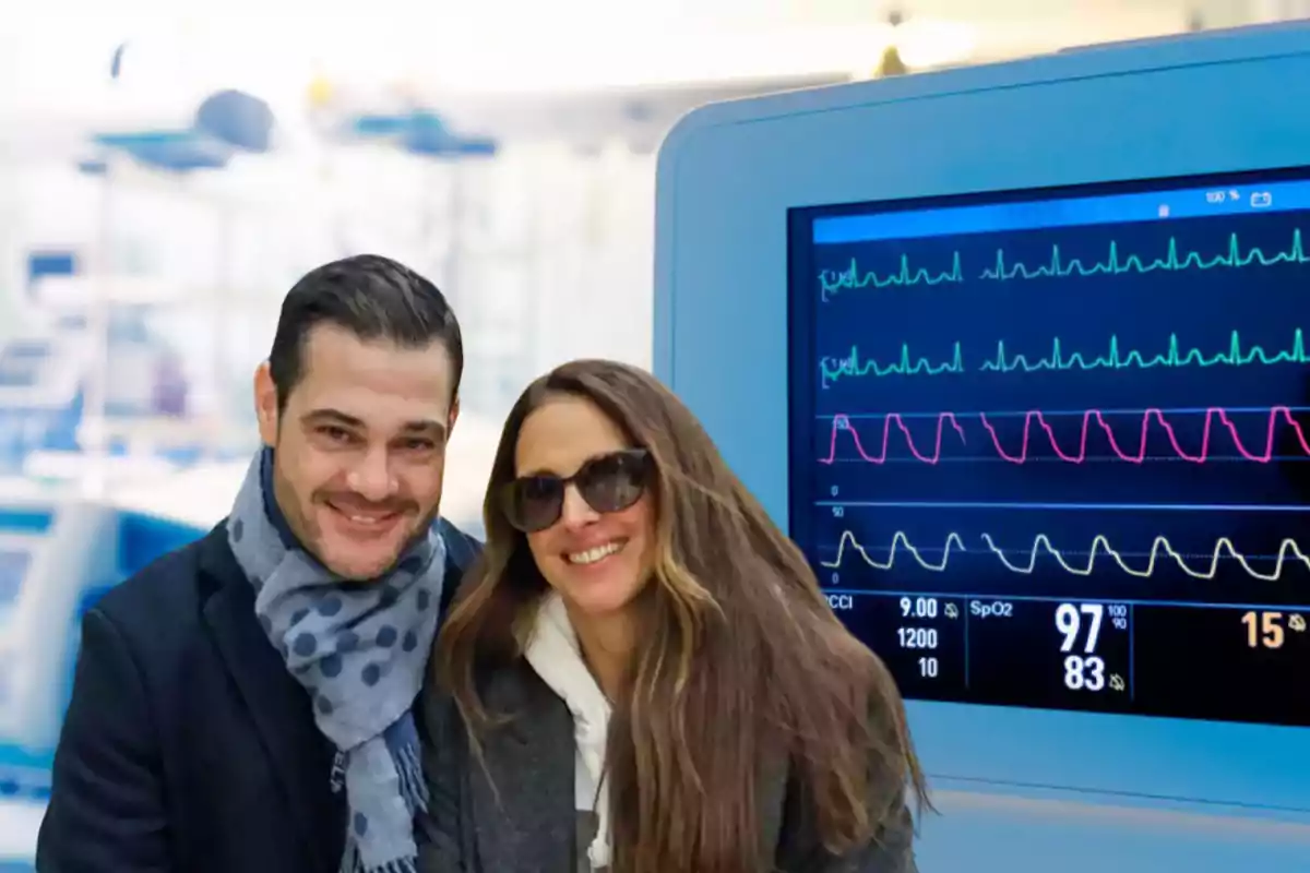 Juan Pablo Laura y Nuria Fergó abrazados y de fondo un monitor de hospital con las costantes vitales