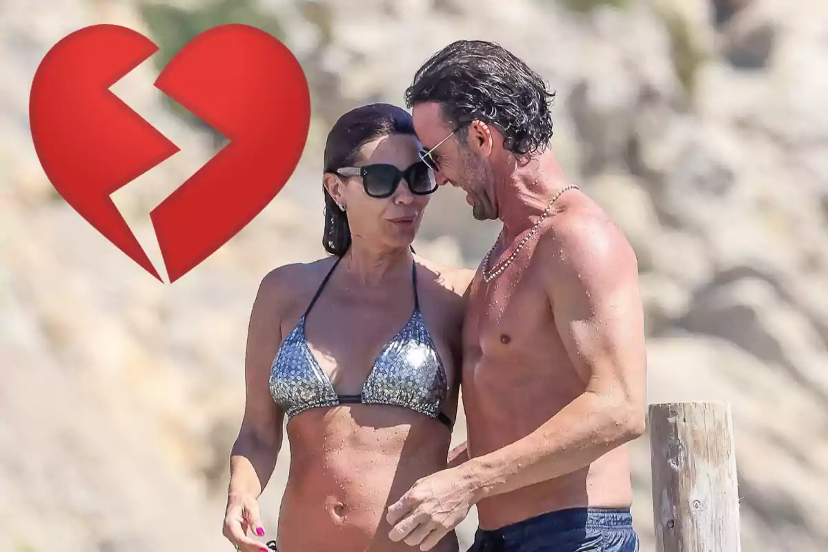 Pareja en la playa con un corazón roto superpuesto en la imagen.