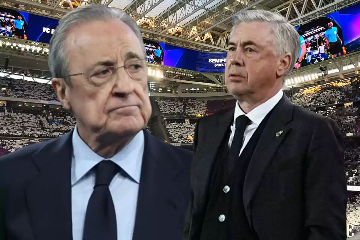 Dos hombres con trajes formales en un estadio de fútbol.