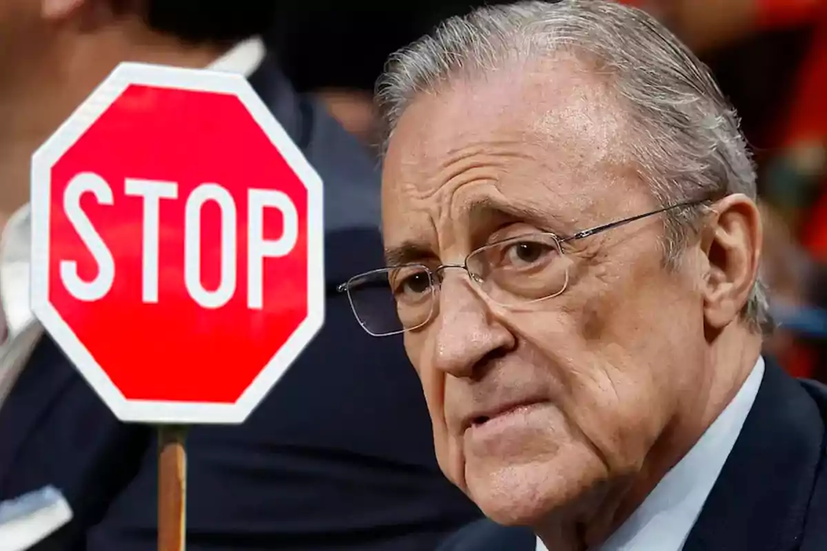 Florentino y un cartel de "STOP" en un evento.