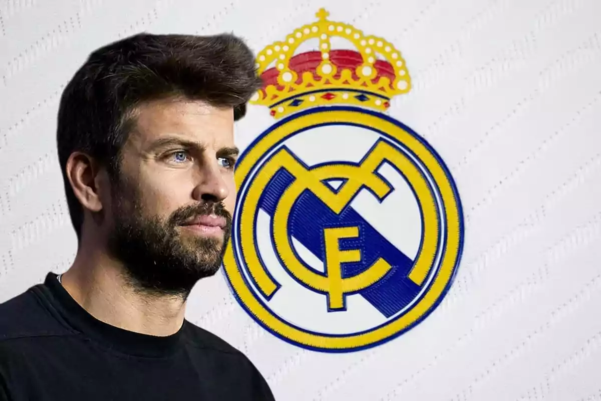 Un hombre con barba y cabello oscuro está frente al escudo del Real Madrid.