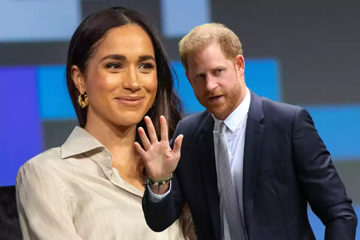 Una mujer sonriente con cabello largo y oscuro y un hombre con barba pelirroja y traje oscuro.