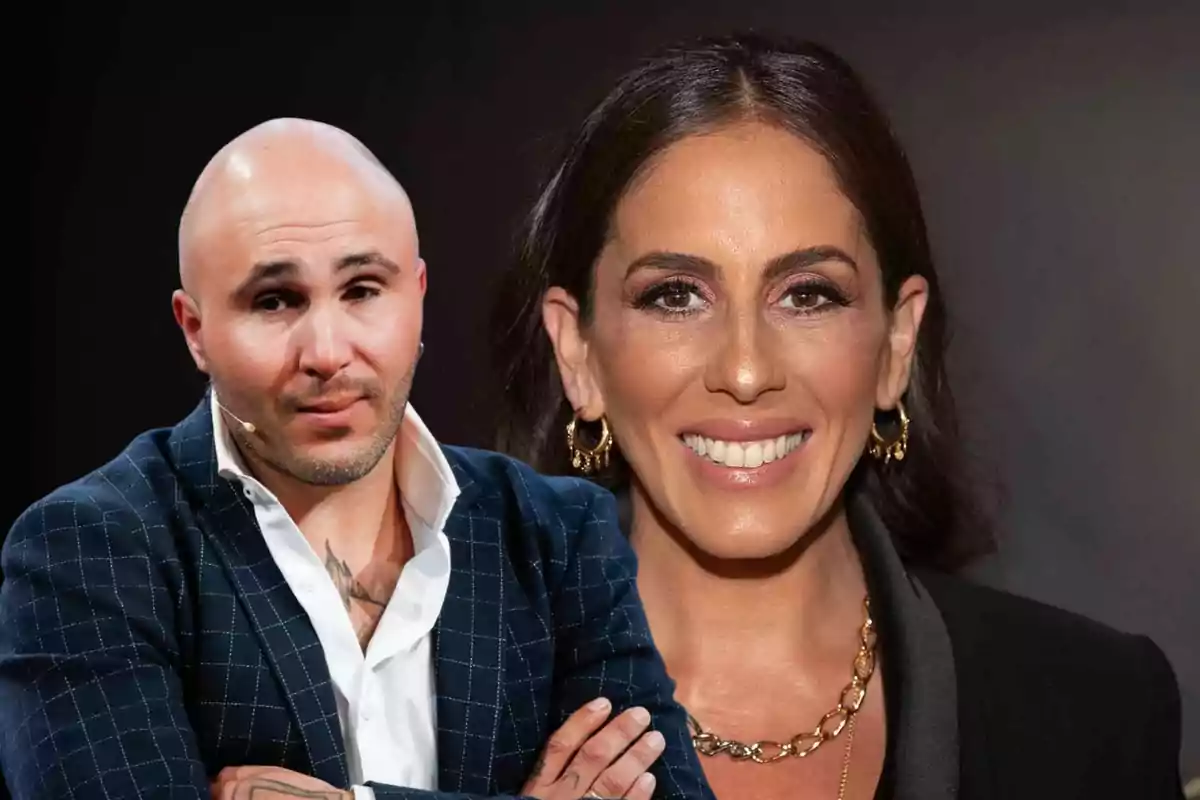 Dos personas posando para una foto, una mujer sonriente con cabello oscuro y un hombre calvo con barba y chaqueta azul.