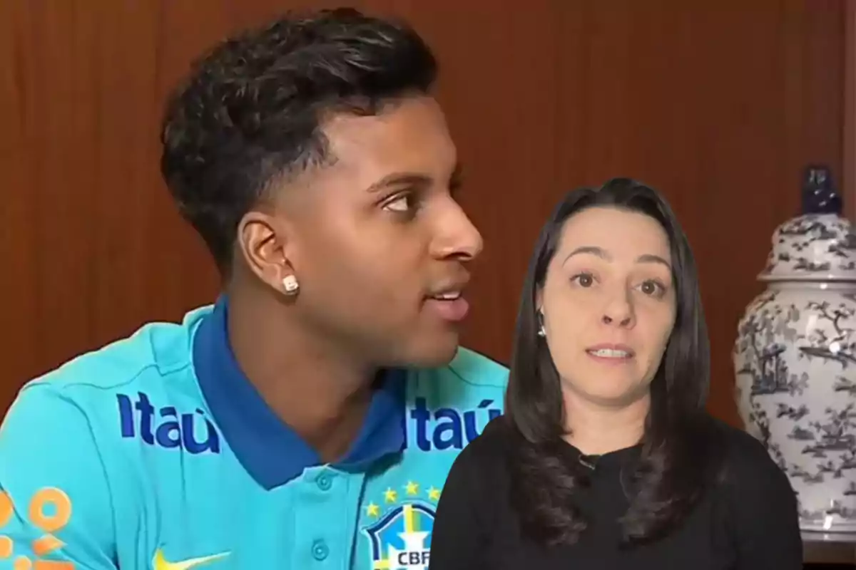 Un hombre con una camiseta de la selección de fútbol de Brasil está mirando hacia la derecha mientras una mujer con cabello oscuro y una expresión seria está en primer plano.