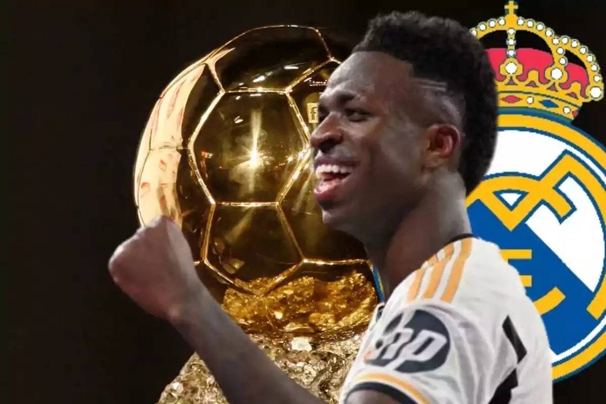 Vinicius con el trofeo del Balón de Oro y el escudo del Real Madrid de fondo.