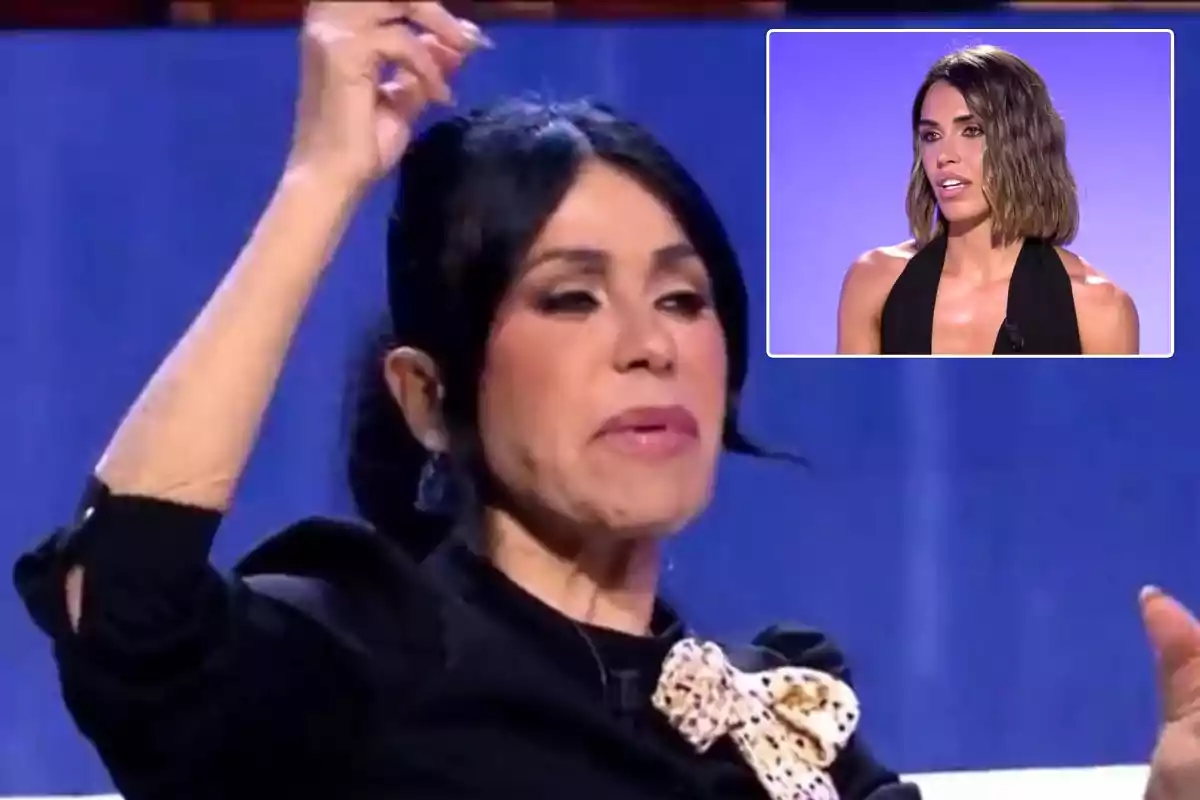 Una persona con cabello oscuro y una blusa negra con un lazo claro, en un entorno de estudio de televisión, con una imagen insertada de otra persona con cabello corto y oscuro sobre un fondo púrpura.