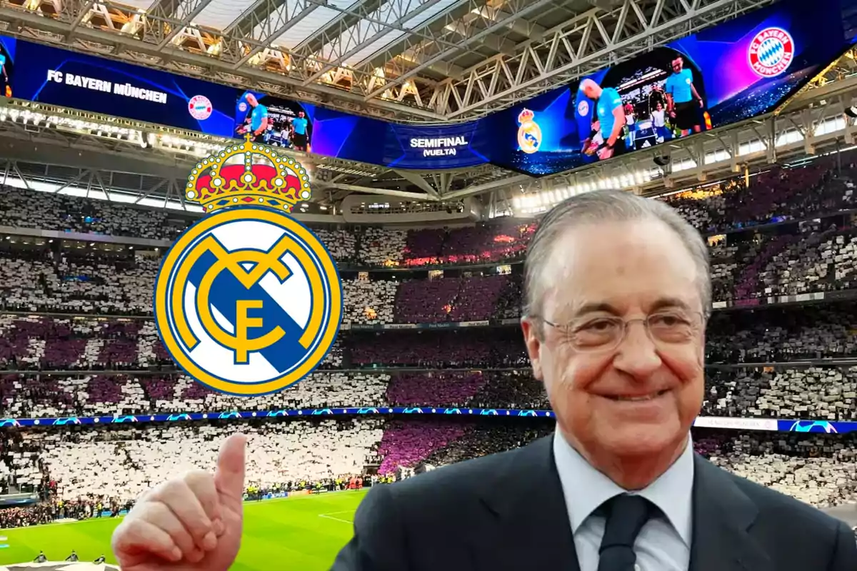 Un hombre sonriente con gafas y traje, levantando el pulgar en un estadio de fútbol con el logo del Real Madrid en primer plano y una pantalla que muestra "FC Bayern München" y "Semifinal (Vuelta)" en el fondo.