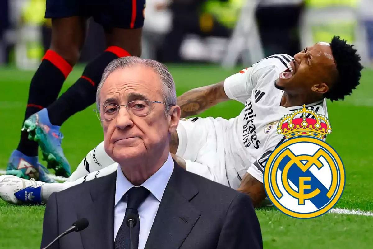 Un hombre con traje y gafas aparece en primer plano mientras un jugador de fútbol del Real Madrid está en el suelo con gesto de dolor en el fondo.