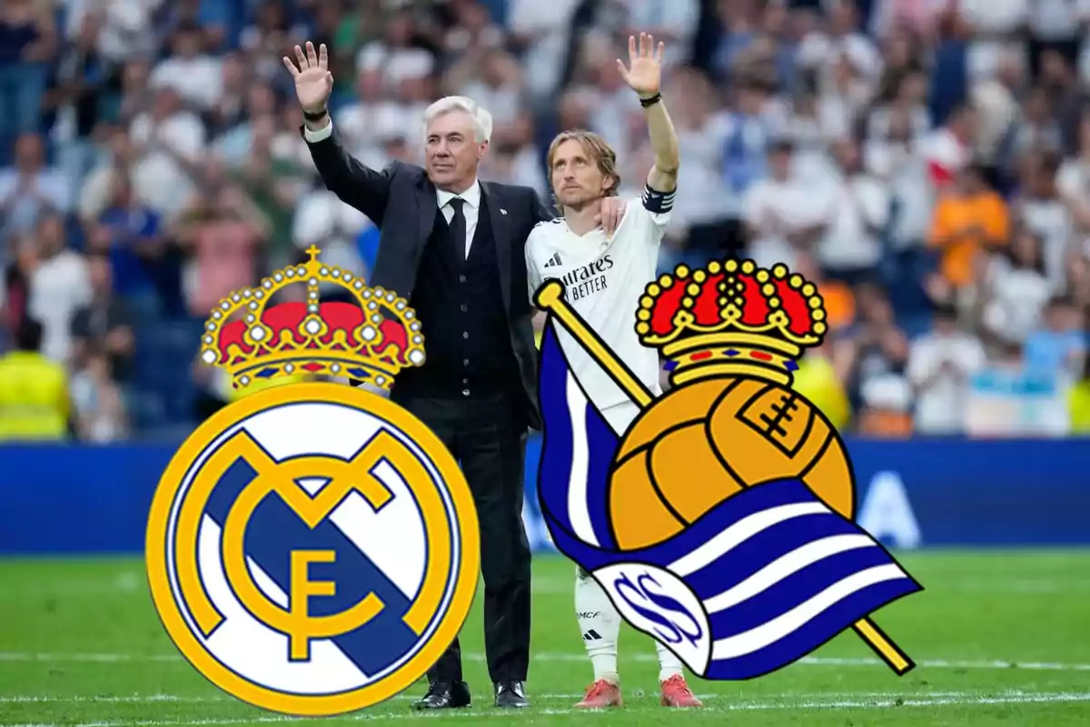Dos personas en un estadio saludan al público, una de ellas lleva un traje oscuro y la otra un uniforme deportivo blanco, con los escudos del Real Madrid y la Real Sociedad superpuestos en la parte inferior.