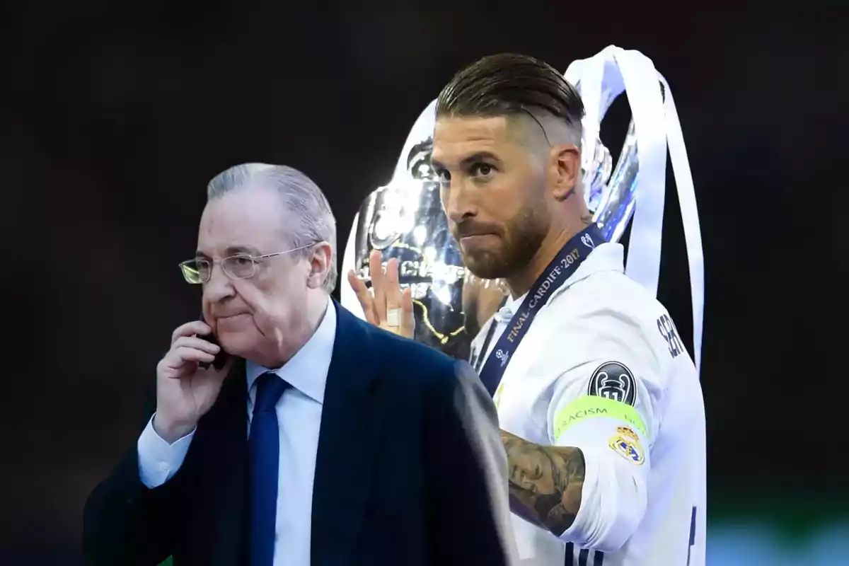 Un hombre con gafas y traje hablando por teléfono junto a otro hombre con uniforme deportivo sosteniendo un trofeo.