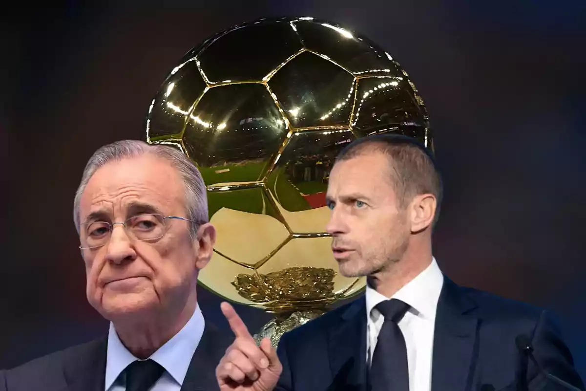 Dos hombres en traje frente a un gran trofeo dorado.