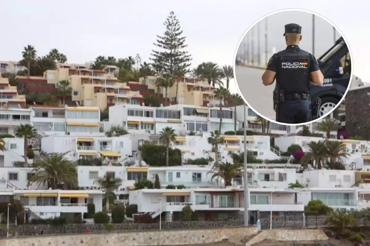Un complejo de apartamentos en una colina con un policía de espaldas en un recuadro.