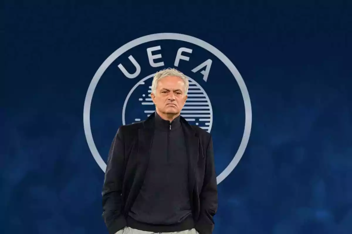 Mourinho con chaqueta y el logo de la UEFA detrás