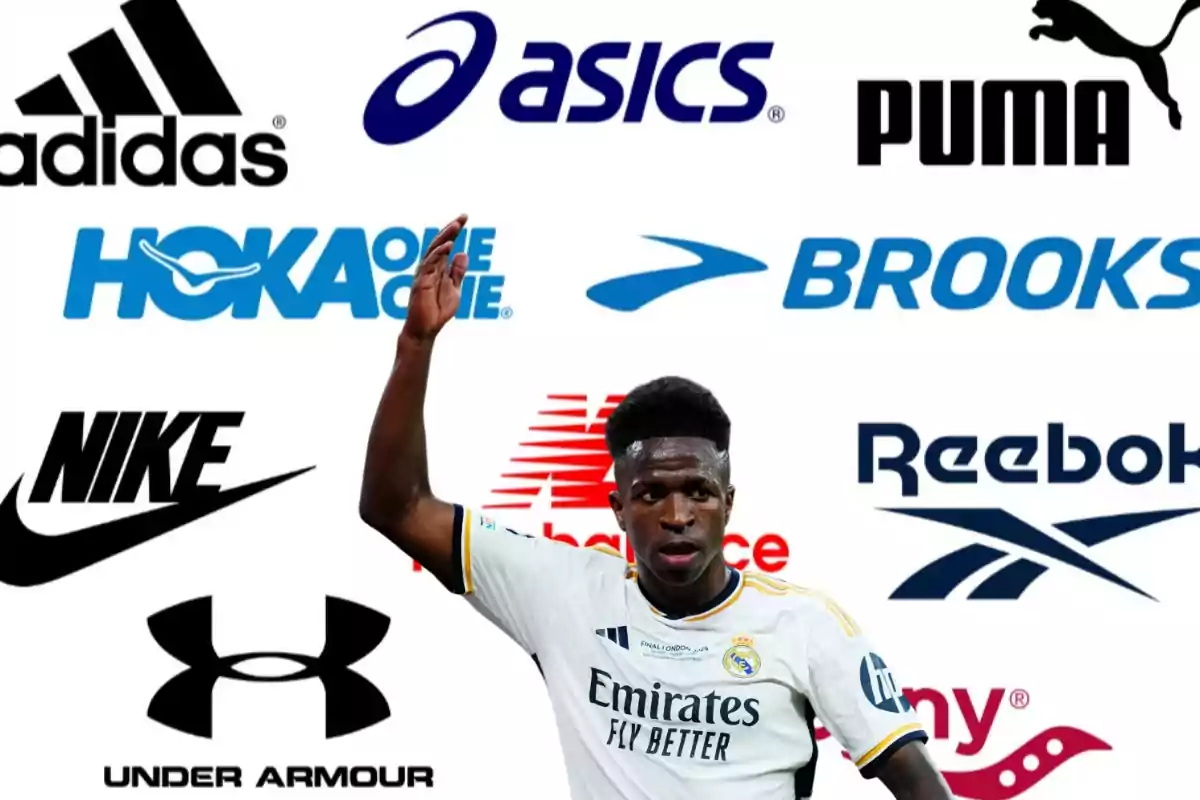 Un jugador de fútbol con la camiseta del Real Madrid levantando la mano, con logotipos de marcas deportivas como Adidas, Asics, Puma, Hoka One One, Brooks, Nike, New Balance, Reebok, Under Armour y Saucony en el fondo.