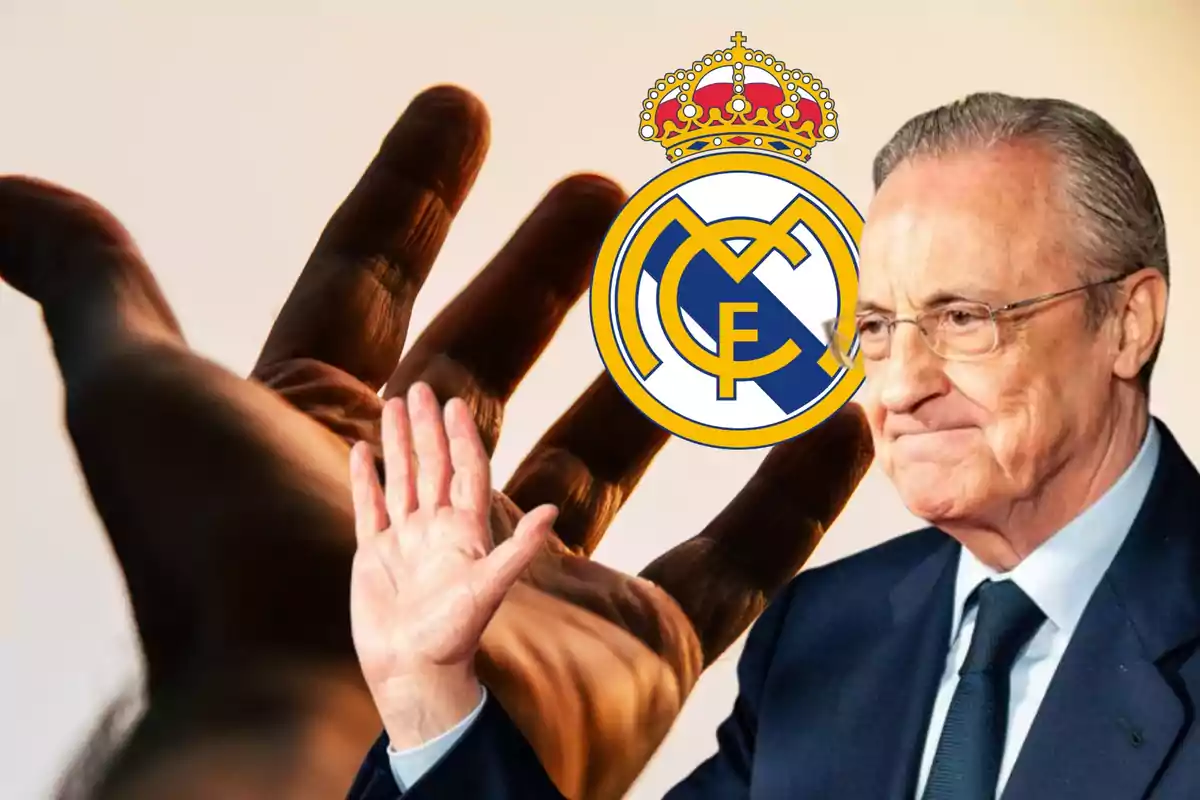 Hombre mayor con gafas y traje saludando con la mano levantada, con el logo del Real Madrid y una mano gigante en el fondo.